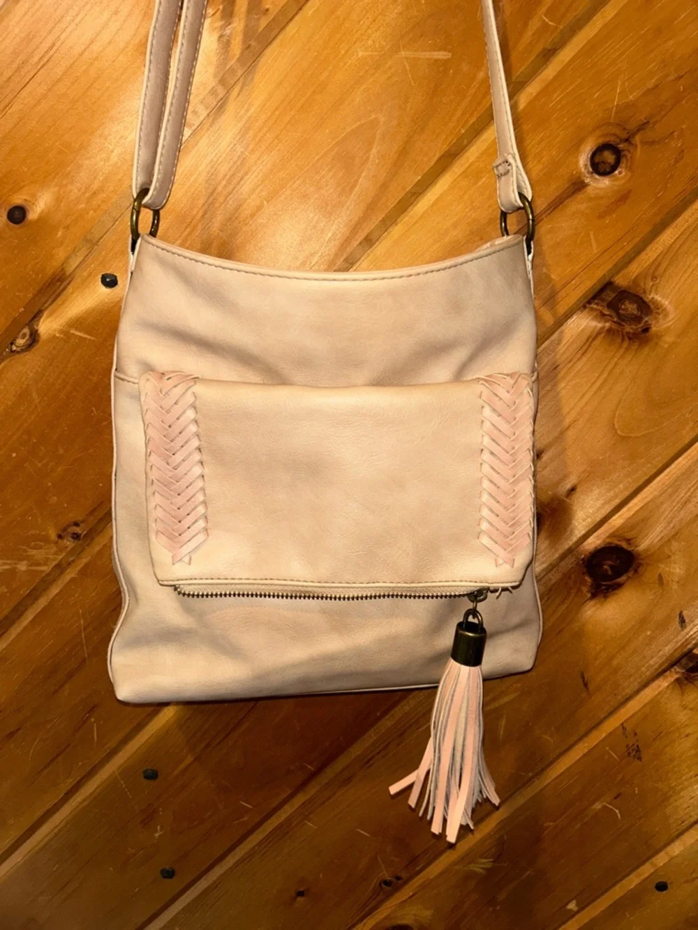 Western style tan crossbody bag with braided & tassels accents